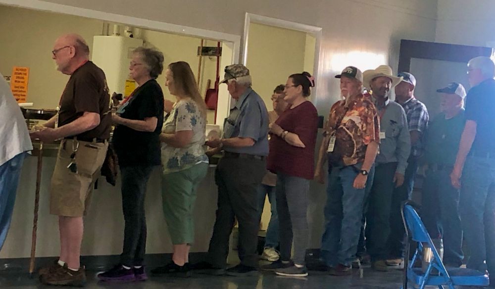 WWCA members and vendors lining up for the catered Saturday evening dinner at the gun show.