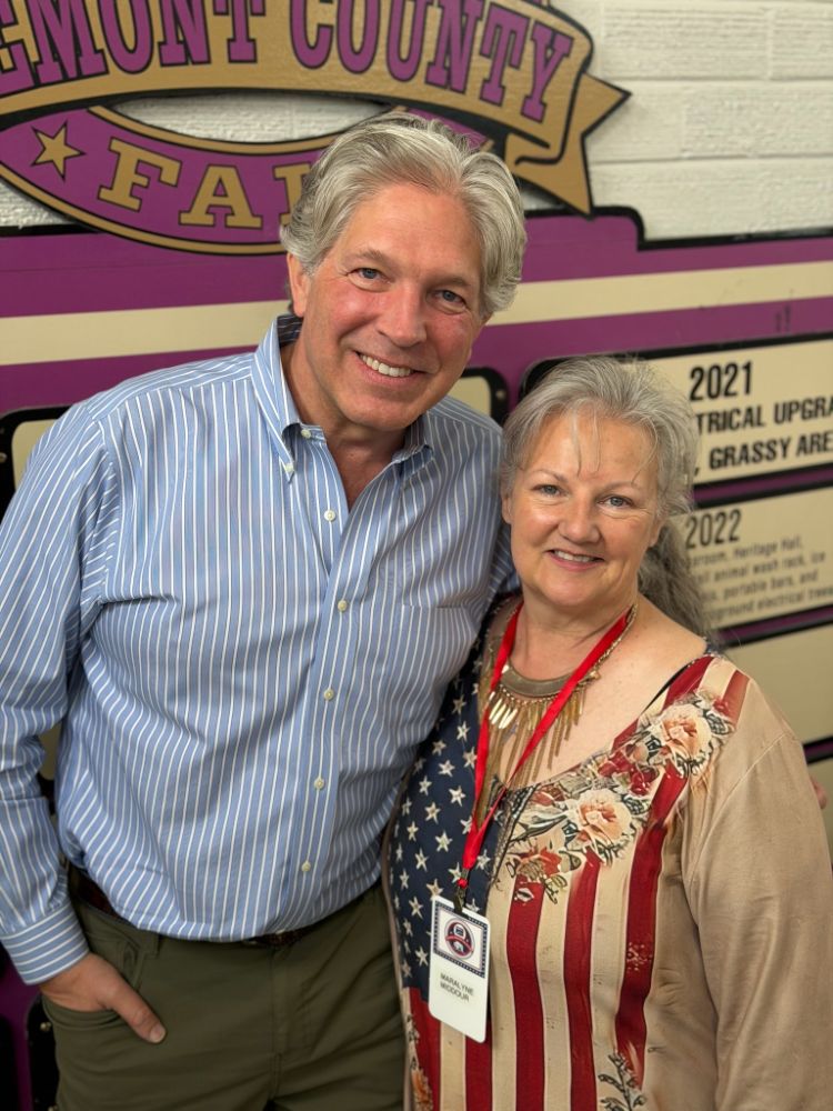 WWCA Secretary-Treasurer Maralyne Middour with a member at the Fremont County Fairgrounds during the gun show.